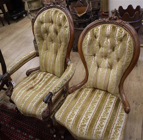 A Victorian carved walnut open armchair (a.f.) and a Victorian carved walnut nursing chair